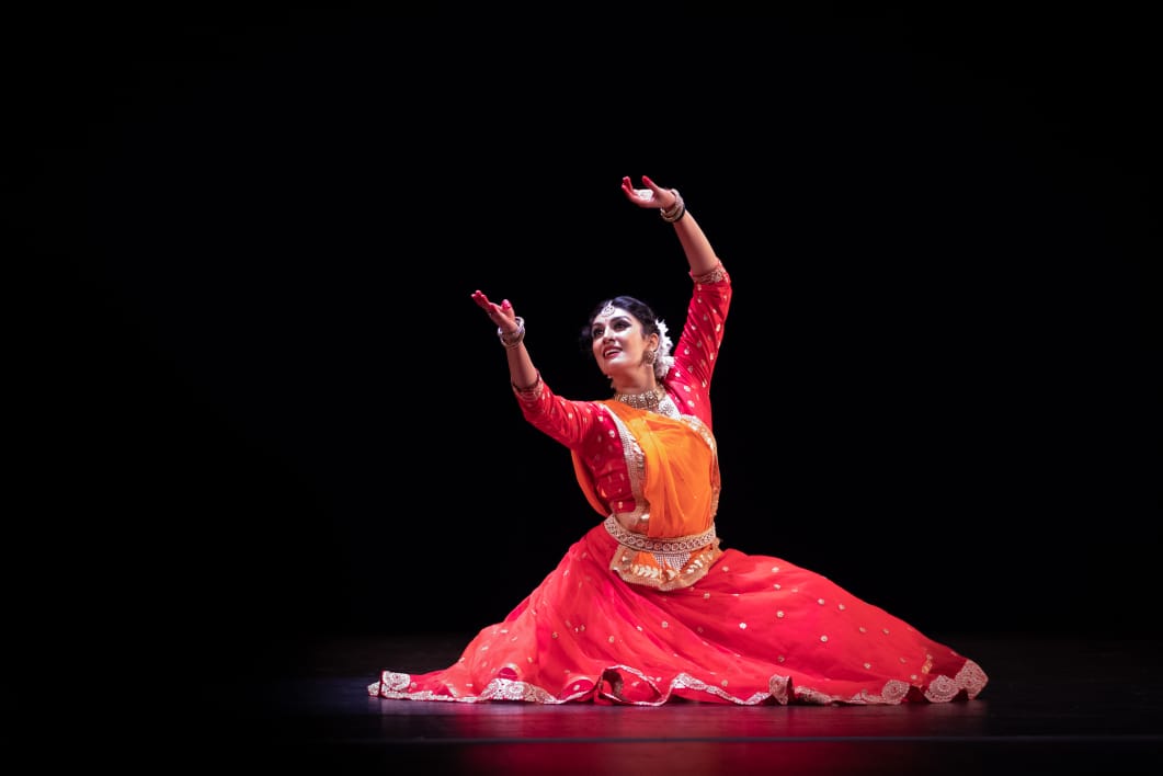 Kathak dancer performing at elegant Indian wedding ceremony