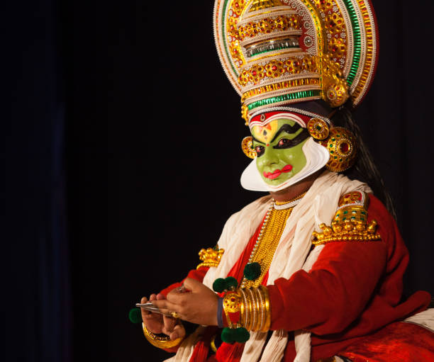 Traditional Kathakali dancer with elaborate face makeup and headdress