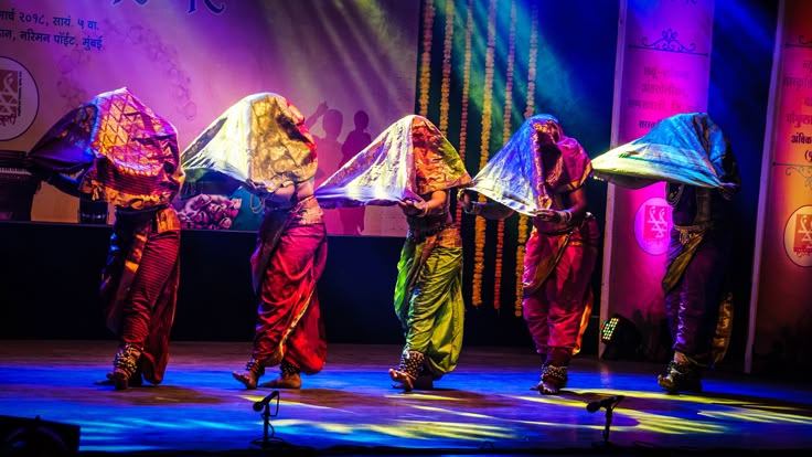 Lavani dancers in vibrant nine-yard saree at cultural event