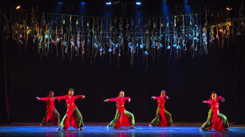 Professional Locking dance crew performing high-energy street dance at urban event