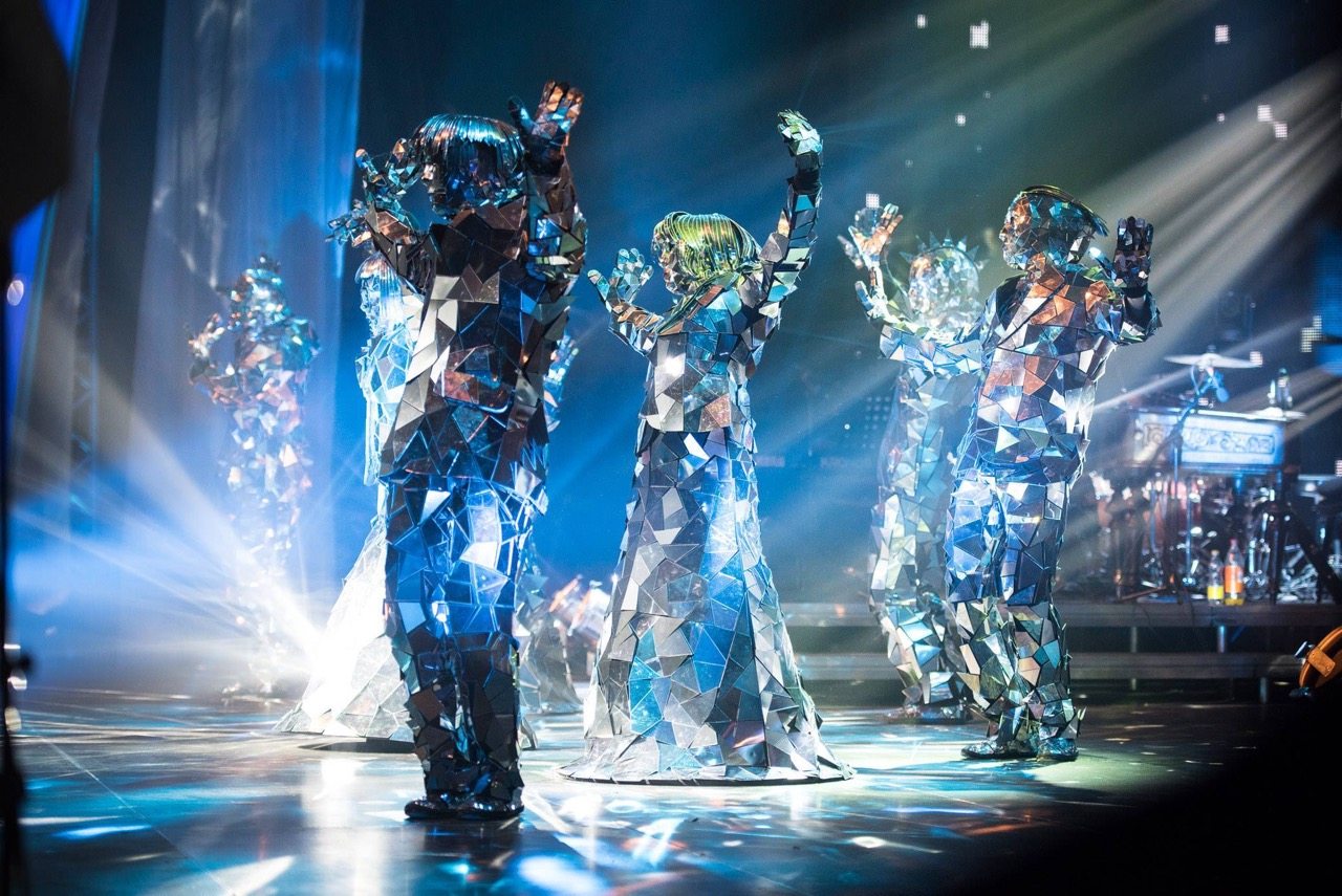 mirror costume dancer performing on futuristic stage