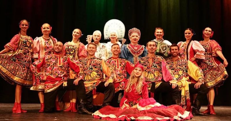 Russian cultural dancers presenting a traditional folk stage performance in costume