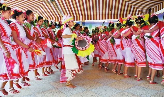 Santhal tribal dancers performing traditional folk dance