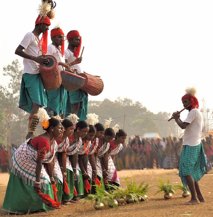 Tribal dancers in colorful traditional costumes