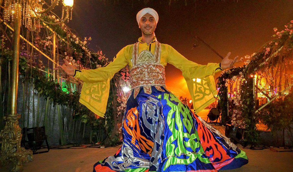 professional tanura dancer performing whirling dance on stage